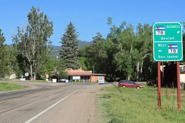 State Highway 78 at the edge of Beulah with cottonwoods and pines