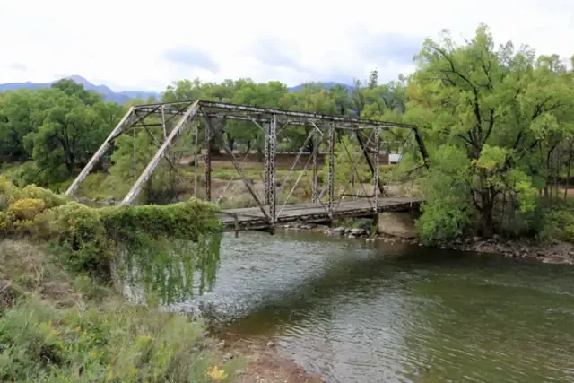 An old steel truss bridge over the Arkansas River at Coaldale