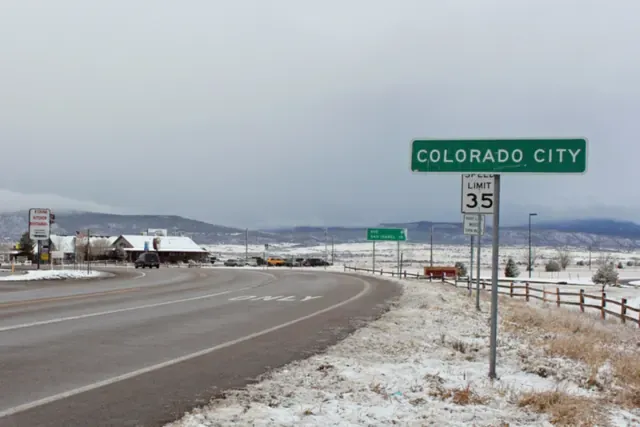 The road into Colorado City in the Greenhorn Valley with a light snow