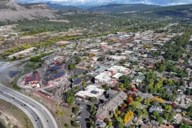 Aerial view of Durango with the narrow gauge rail yard, downtown and the Animas Valley