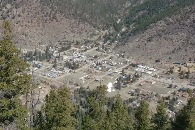 The town of Empire seen from Douglas Mountain with the valley and peaks around it