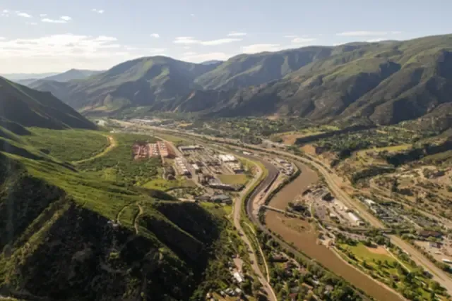 Glenwood Springs along the Colorado River with Glenwood Canyon and the mountains behind