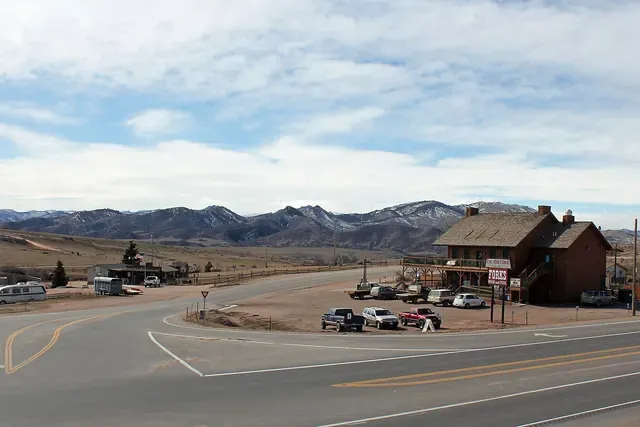 US 287 at Livermore with a road heading toward the foothills and mountains