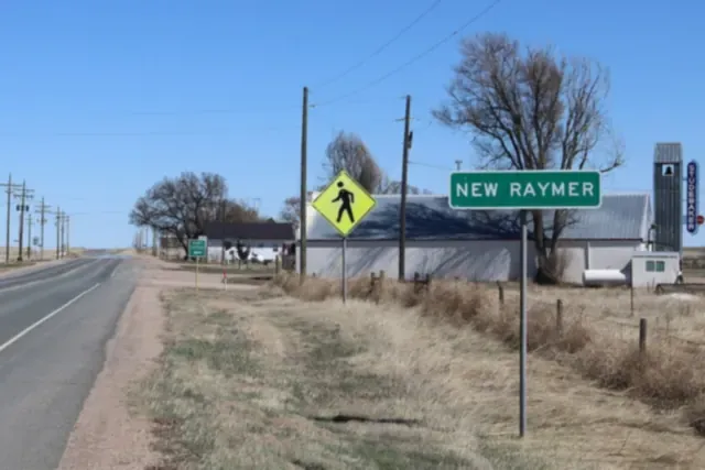 Highway 14 passing the edge of New Raymer on the plains