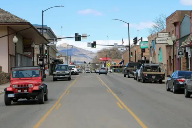 Railroad Avenue in downtown Rifle with the Grand Hogback in the distance