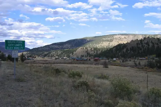 Homes and cabins of South Fork below forested ridges