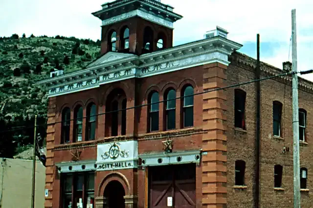 Victor's historic brick city hall on a hillside street