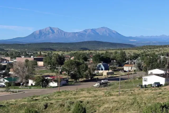 Walsenburg rooftops with the Spanish Peaks and the Culebra Range behind